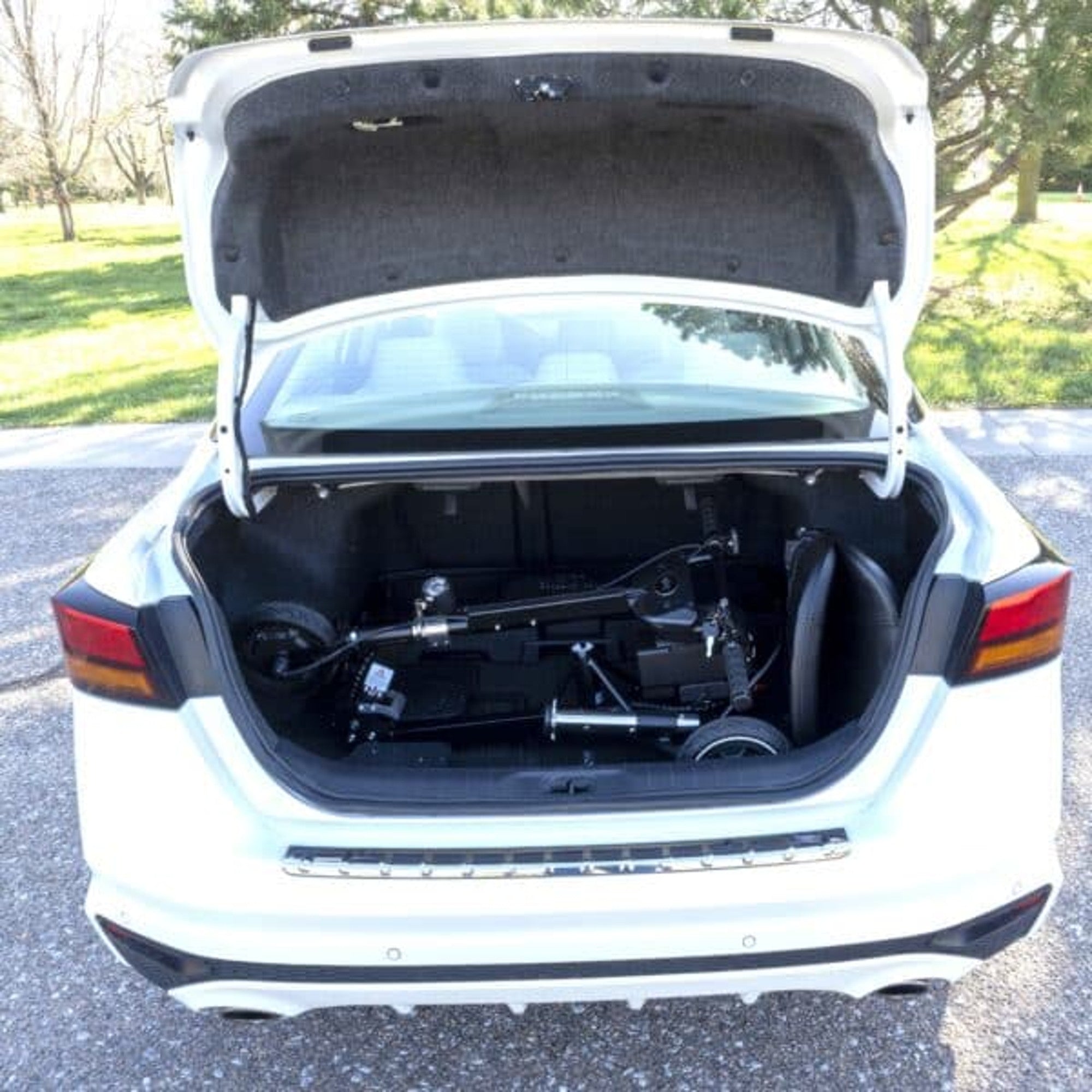 SnapnGO Deluxe Mobility Scooter folded to fit inside a standard car trunk for easy transport